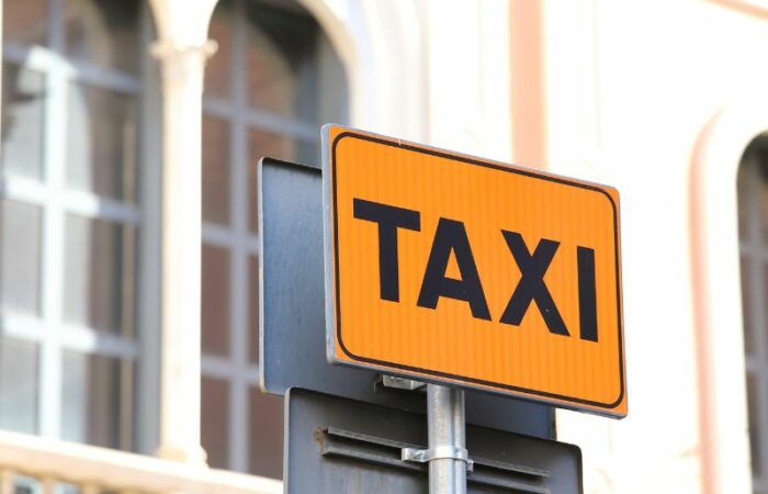 a label about taxi in Rome. A sign on the street of Rome in yellow and black