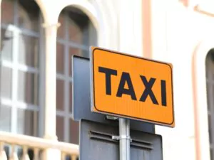 a label about taxi in Rome. A sign on the street of Rome in yellow and black